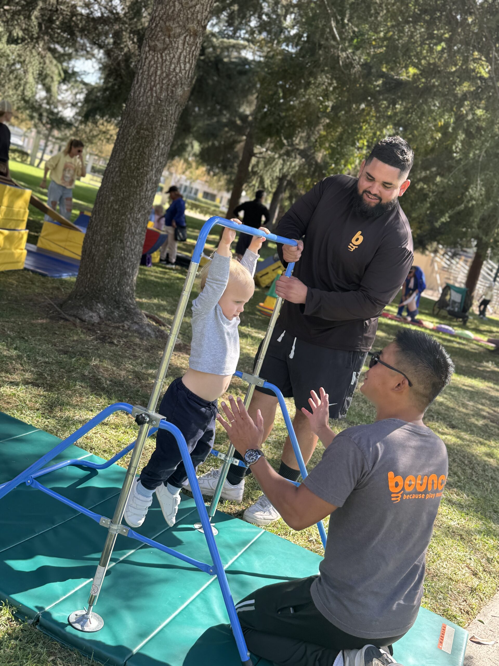 Bounce kids running obstacle course at the park